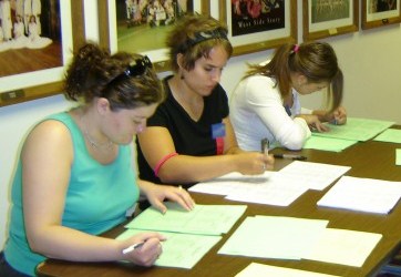 Group of Girls Stater sitting around a table working