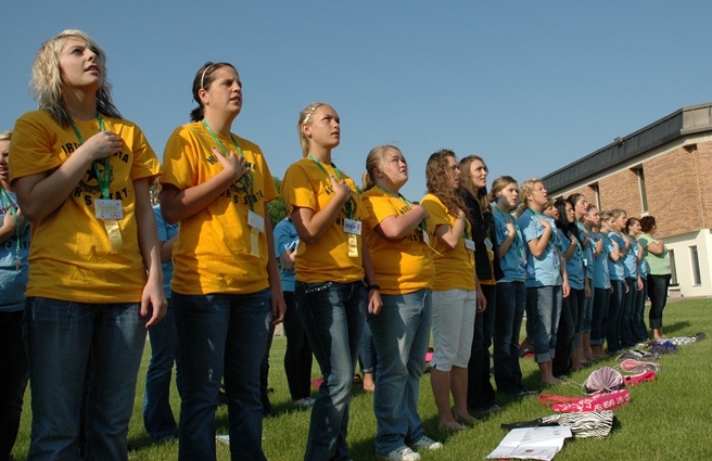 Citizens reciting pledge at flag raising