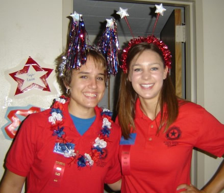 Two girls in red shirts and start attennae
